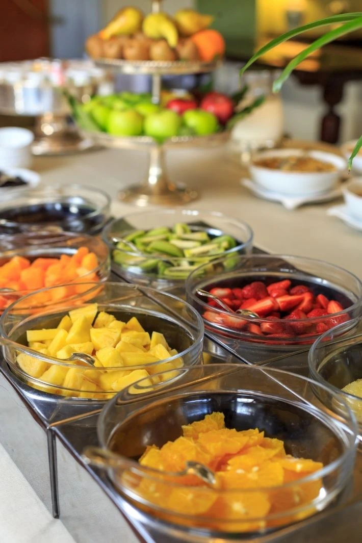 Colorful fruit buffet setup at a chic, affordable venue, ideal for DIY micro weddings or baby showers. The Boho Space Small Event Venue in Phoenix, AZ.